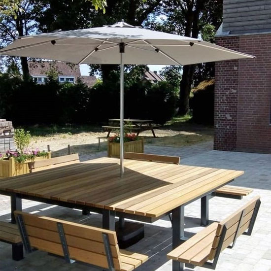 A table with a canopy and 4 seats